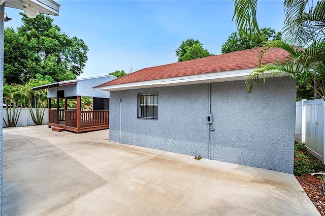 1553 Wright Dr, Lakeland, FL 33805 - view of home's exterior with stucco siding and a patio area
