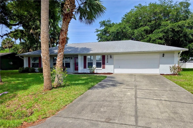 2909 Pine Tree Dr, Edgewater, FL 32141 - ranch-style house featuring driveway, stucco siding, an attached garage, and a front lawn