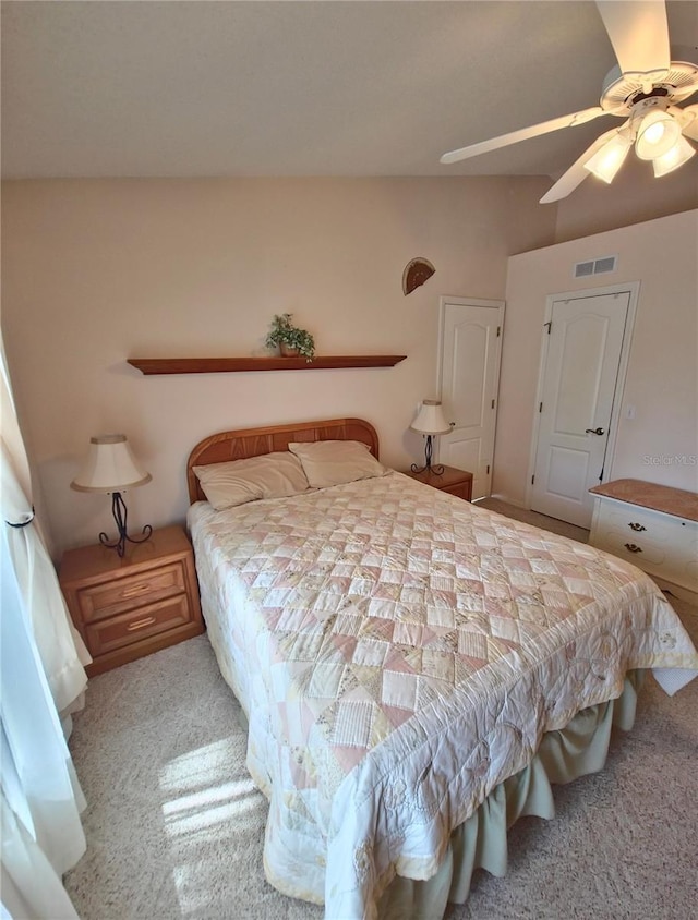 2909 Pine Tree Dr, Edgewater, FL 32141 - carpeted bedroom featuring a ceiling fan
