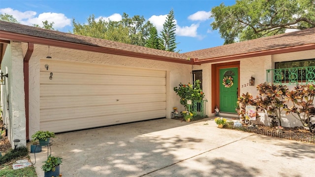 527 Duchess Dr, Lakeland, FL 33803 - view of front of house featuring an attached garage, stucco siding, concrete driveway, and roof with shingles