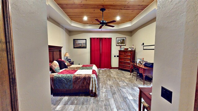 540 Phillips Rd, Sebring, FL 33875 - bedroom featuring wood ceiling, wood finished floors, a raised ceiling, a textured wall, and a ceiling fan