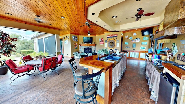 540 Phillips Rd, Sebring, FL 33875 - kitchen featuring ceiling fan, a fireplace, wooden ceiling, a sink, and recessed lighting