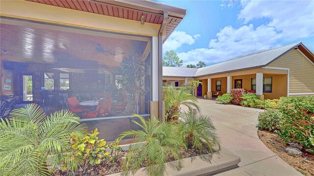 540 Phillips Rd, Sebring, FL 33875 - view of home's exterior featuring metal roof and stucco siding
