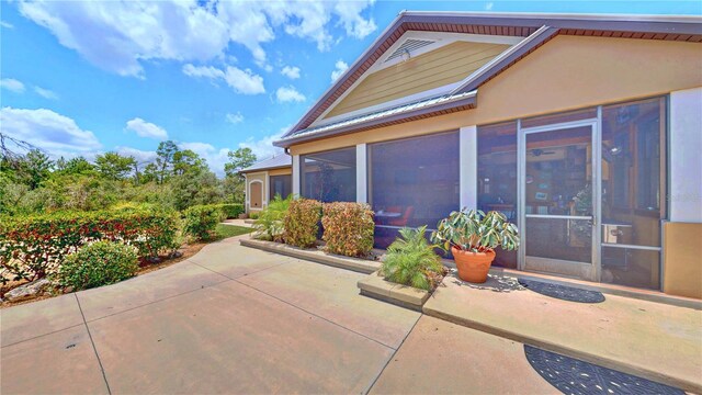 540 Phillips Rd, Sebring, FL 33875 - view of home's exterior with a patio and a sunroom