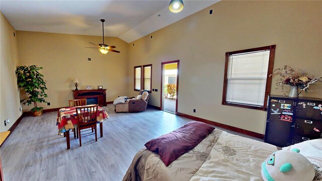 540 Phillips Rd, Sebring, FL 33875 - bedroom with wood finished floors, baseboards, and high vaulted ceiling