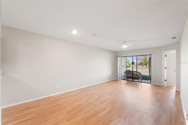 703 Magnolia Pl Unit 703, Winter Haven, FL 33884 - unfurnished room with ceiling fan, light wood-style flooring, baseboards, a textured ceiling, and recessed lighting