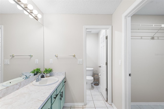 703 Magnolia Pl Unit 703, Winter Haven, FL 33884 - full bathroom featuring vanity, tile patterned flooring, toilet, a spacious closet, and baseboards