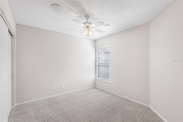 703 Magnolia Pl Unit 703, Winter Haven, FL 33884 - unfurnished bedroom with a closet, carpet floors, a textured ceiling, a ceiling fan, and baseboards