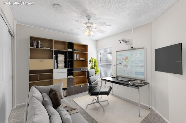 703 Magnolia Pl Unit 703, Winter Haven, FL 33884 - home office with carpet flooring, a ceiling fan, baseboards, and a textured ceiling