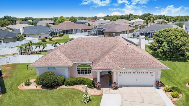 413 Ruby Lake Pl, Winter Haven, FL 33884 - single story home featuring an attached garage, a residential view, concrete driveway, a chimney, and stucco siding