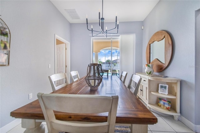 413 Ruby Lake Pl, Winter Haven, FL 33884 - dining area with a chandelier and baseboards