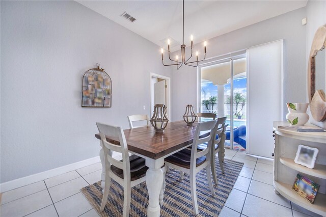 413 Ruby Lake Pl, Winter Haven, FL 33884 - dining area with a chandelier, light tile patterned floors, and baseboards