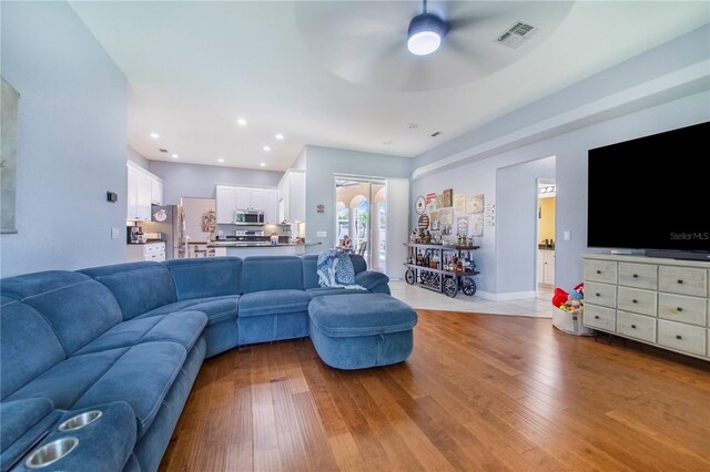 413 Ruby Lake Pl, Winter Haven, FL 33884 - living room featuring ceiling fan, wood finished floors, and recessed lighting