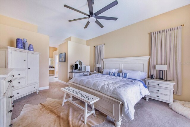 413 Ruby Lake Pl, Winter Haven, FL 33884 - bedroom with light colored carpet, baseboards, and ceiling fan