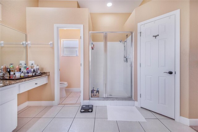 413 Ruby Lake Pl, Winter Haven, FL 33884 - full bathroom with a stall shower, toilet, vanity, and baseboards