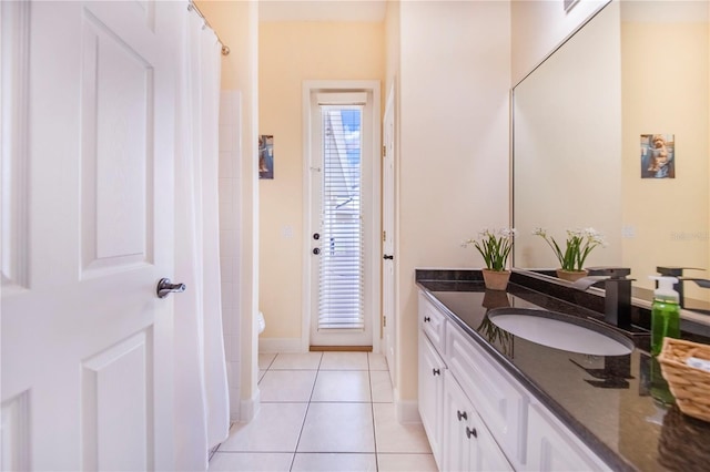 413 Ruby Lake Pl, Winter Haven, FL 33884 - bathroom featuring vanity, tile patterned floors, toilet, and baseboards