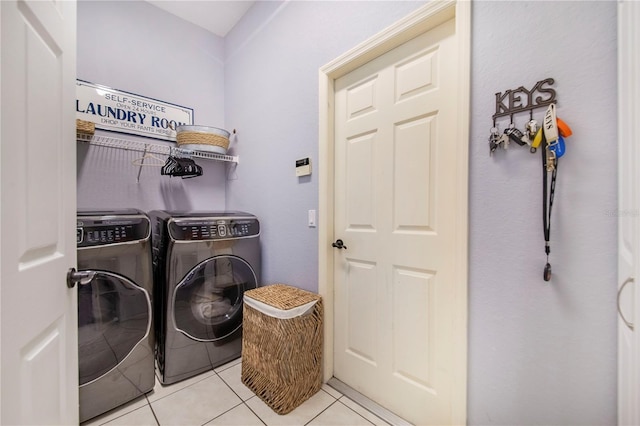 413 Ruby Lake Pl, Winter Haven, FL 33884 - laundry room with washer and dryer and light tile patterned floors
