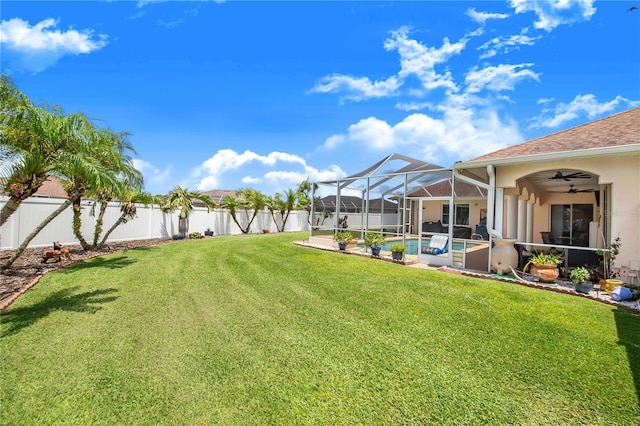 413 Ruby Lake Pl, Winter Haven, FL 33884 - view of yard featuring ceiling fan, a patio, and glass enclosure