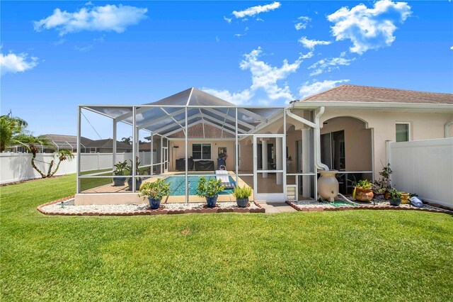 413 Ruby Lake Pl, Winter Haven, FL 33884 - rear view of house featuring stucco siding and a lanai