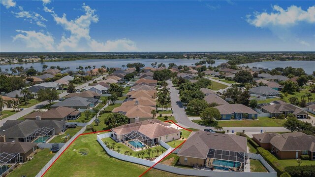 413 Ruby Lake Pl, Winter Haven, FL 33884 - aerial perspective of suburban area featuring a large body of water and property parcel outlined
