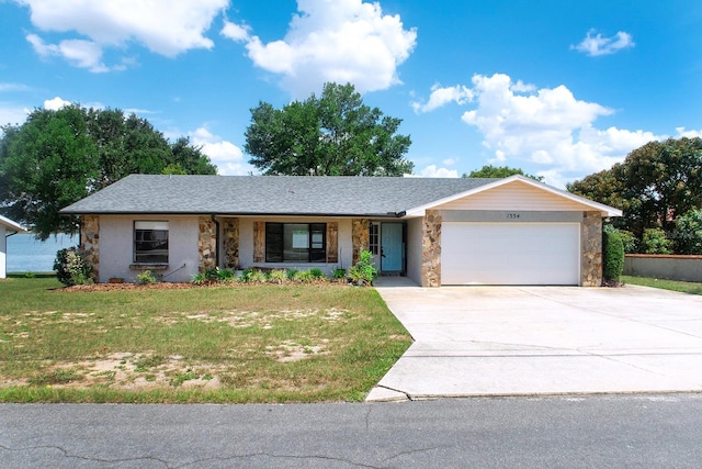 1334 Highland Park Dr S, Lake Wales, FL 33898 - single story home featuring stone siding, an attached garage, and a front lawn