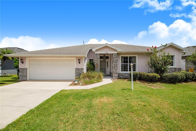 114 Belmont Dr, Winter Haven, FL 33884 - single story home featuring stone siding, a garage, driveway, and a front yard