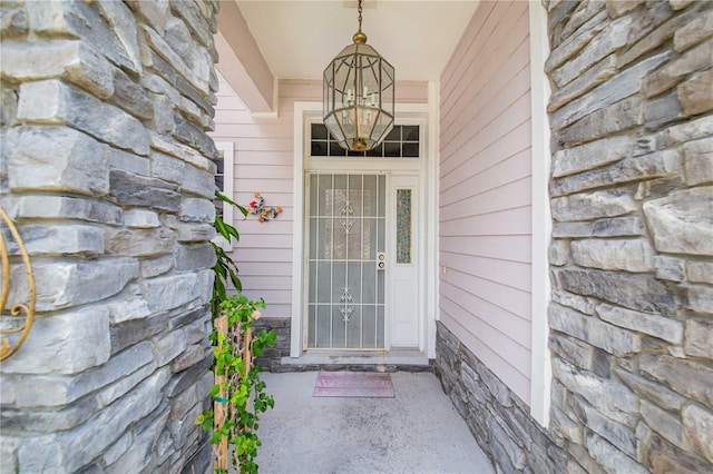 114 Belmont Dr, Winter Haven, FL 33884 - property entrance featuring stone siding
