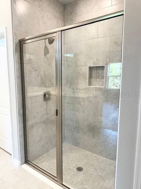 4956 San Lorenzo Dr, Sebring, FL 33872 - full bathroom featuring a stall shower and tile patterned floors
