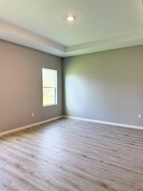 4956 San Lorenzo Dr, Sebring, FL 33872 - spare room with baseboards and wood finished floors