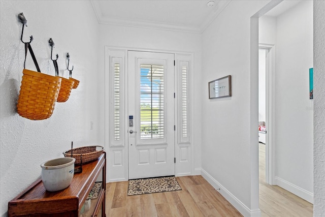 505 Adams View Ln, Auburndale, FL 33823 - foyer entrance featuring light wood-style floors, ornamental molding, and baseboards
