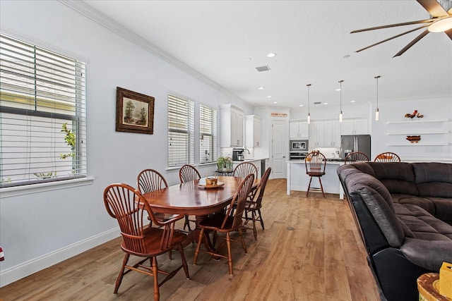 505 Adams View Ln, Auburndale, FL 33823 - dining area featuring ceiling fan, light wood-style floors, recessed lighting, ornamental molding, and baseboards