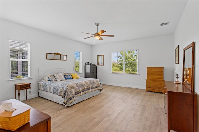 505 Adams View Ln, Auburndale, FL 33823 - bedroom with light wood-style floors, baseboards, and ceiling fan