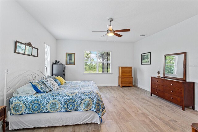 505 Adams View Ln, Auburndale, FL 33823 - bedroom featuring light wood-style floors, baseboards, and ceiling fan