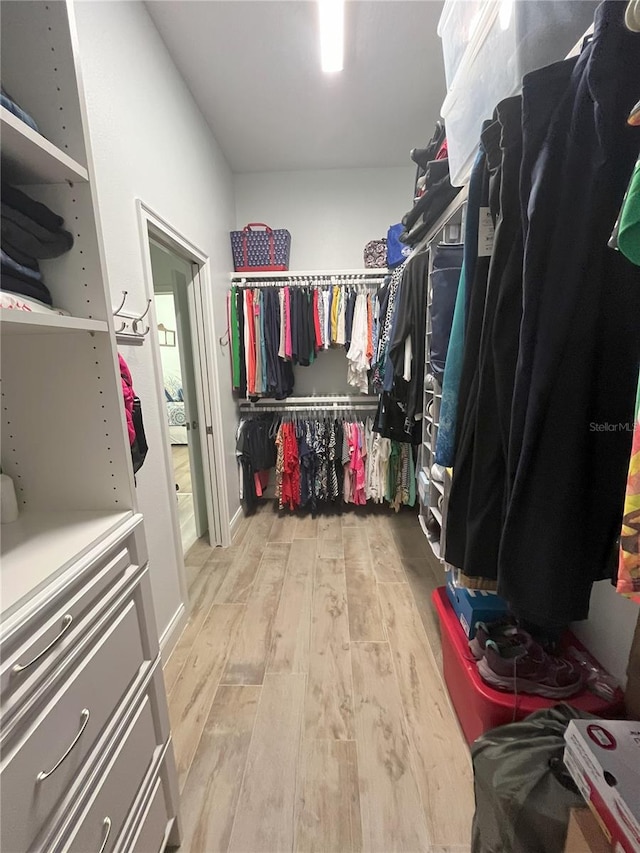 505 Adams View Ln, Auburndale, FL 33823 - walk in closet featuring wood finished floors