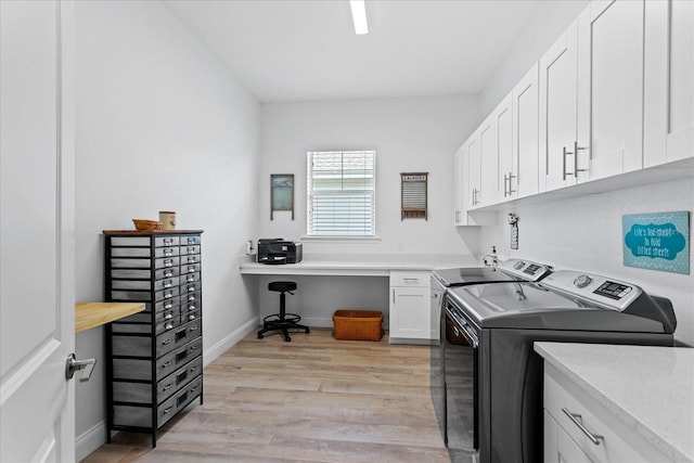 505 Adams View Ln, Auburndale, FL 33823 - laundry room with independent washer and dryer, cabinet space, light wood-type flooring, and baseboards