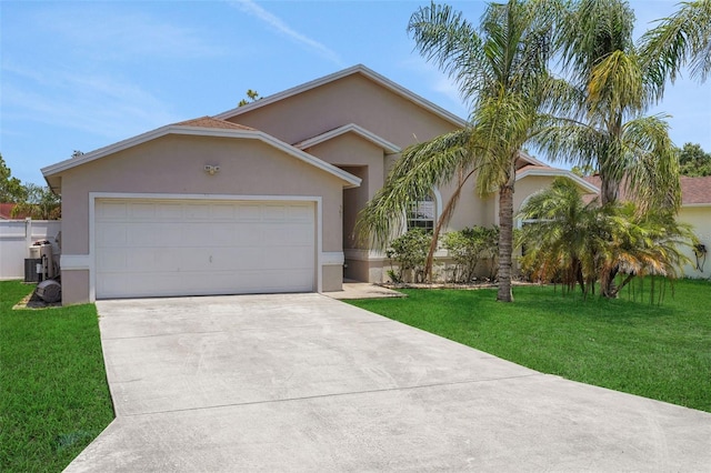 362 Lake Daisy Cir, Winter Haven, FL 33884 - ranch-style home featuring stucco siding, driveway, an attached garage, and a front yard