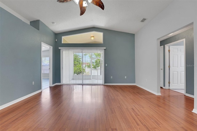 362 Lake Daisy Cir, Winter Haven, FL 33884 - empty room featuring a ceiling fan, vaulted ceiling, wood finished floors, and baseboards