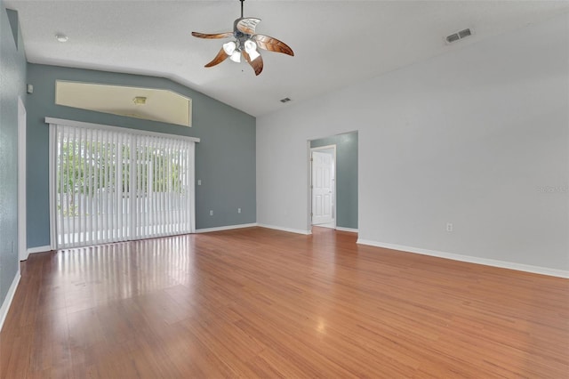 362 Lake Daisy Cir, Winter Haven, FL 33884 - empty room with a ceiling fan, lofted ceiling, baseboards, and wood finished floors