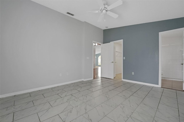 362 Lake Daisy Cir, Winter Haven, FL 33884 - empty room featuring a ceiling fan, baseboards, and marble look tiles