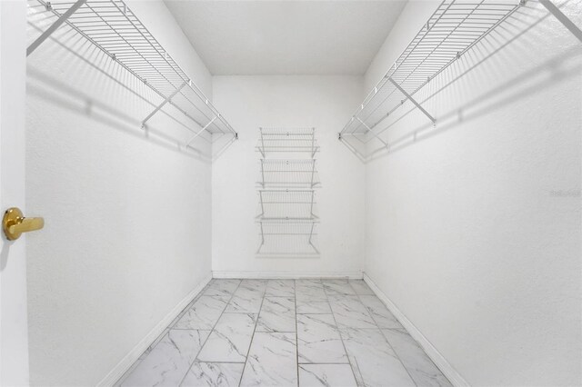 362 Lake Daisy Cir, Winter Haven, FL 33884 - spacious closet featuring light marble finish floors