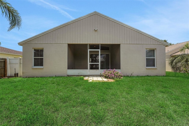 362 Lake Daisy Cir, Winter Haven, FL 33884 - rear view of house with a sunroom and stucco siding