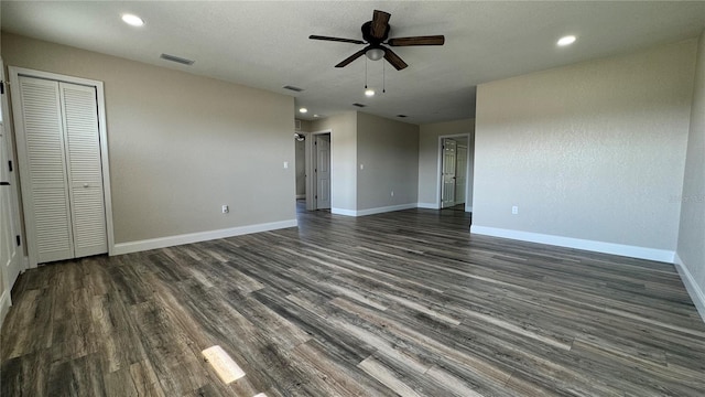 1735 Council Dr, Sun City Center, FL 33573 - unfurnished living room with ceiling fan, baseboards, dark wood-style flooring, and recessed lighting