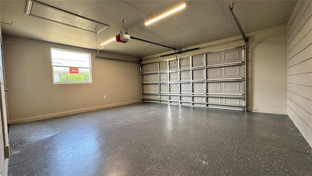 1735 Council Dr, Sun City Center, FL 33573 - garage with baseboards and a garage door opener
