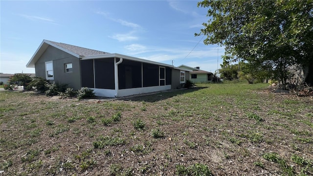 1735 Council Dr, Sun City Center, FL 33573 - rear view of property with a sunroom
