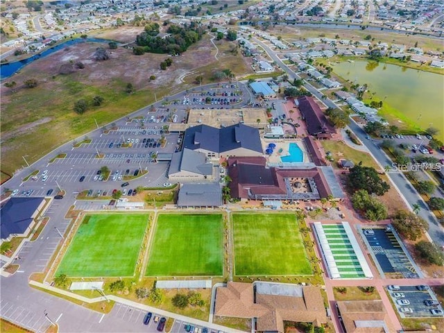 1735 Council Dr, Sun City Center, FL 33573 - aerial view of property and surrounding area featuring a large body of water
