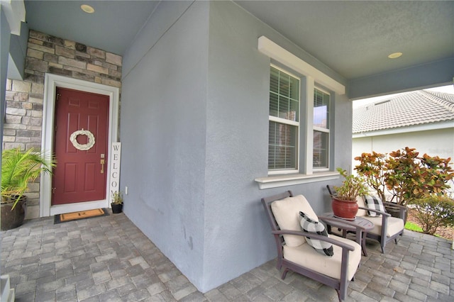 1433 Bunker Dr, Davenport, FL 33896 - doorway to property with stucco siding and stone siding