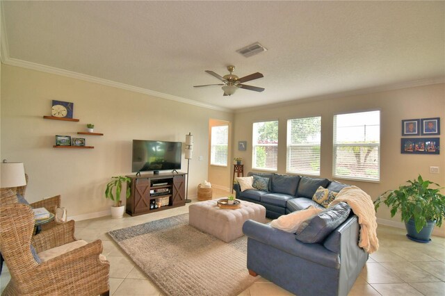 1433 Bunker Dr, Davenport, FL 33896 - living room with light tile patterned floors, crown molding, a ceiling fan, and baseboards