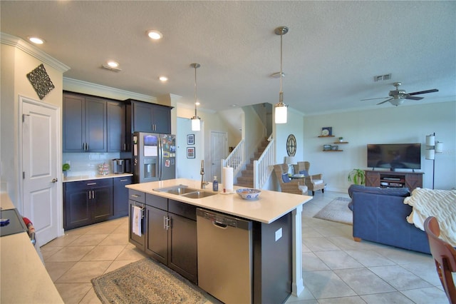 1433 Bunker Dr, Davenport, FL 33896 - kitchen featuring stainless steel appliances, a sink, open floor plan, ornamental molding, and light tile patterned flooring