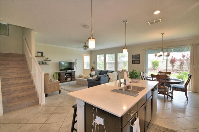 1433 Bunker Dr, Davenport, FL 33896 - kitchen featuring a sink, light tile patterned flooring, crown molding, a chandelier, and light countertops