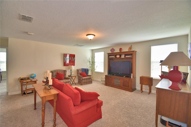 1433 Bunker Dr, Davenport, FL 33896 - carpeted living room with a textured ceiling and baseboards